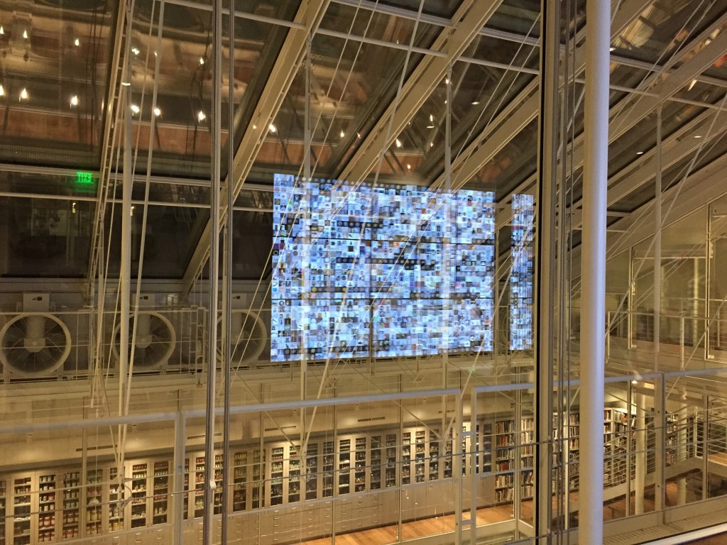 Figure 17 – The holographic effect of the video wall reflected in the glass walls of the Lightbox Gallery