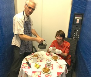 David Costanza and Liz Neely have tea in the Harwood Museum's freight elevator promoting Art+Tea